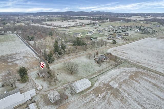 birds eye view of property featuring a mountain view and a rural view