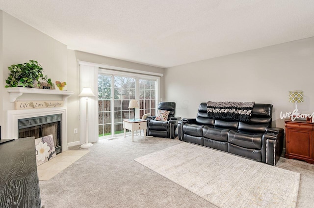 living room with light colored carpet and a textured ceiling