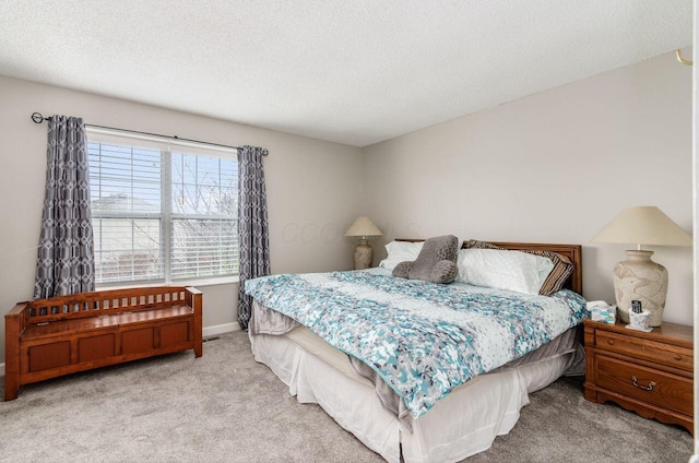 carpeted bedroom with a textured ceiling