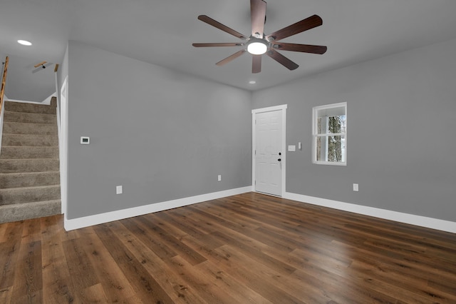 empty room featuring dark hardwood / wood-style flooring and ceiling fan