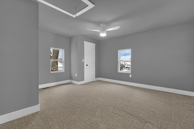 carpeted empty room featuring ceiling fan