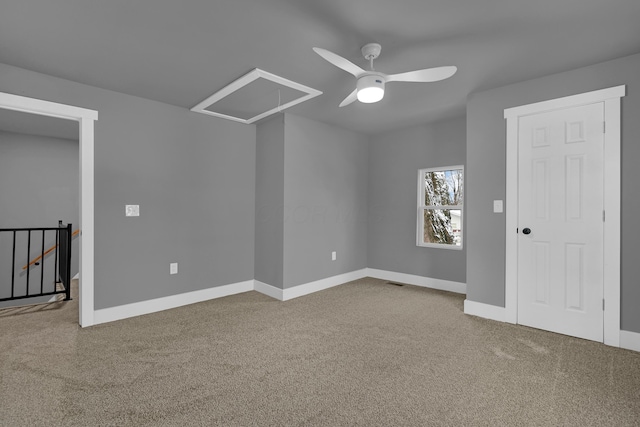 carpeted empty room with ceiling fan