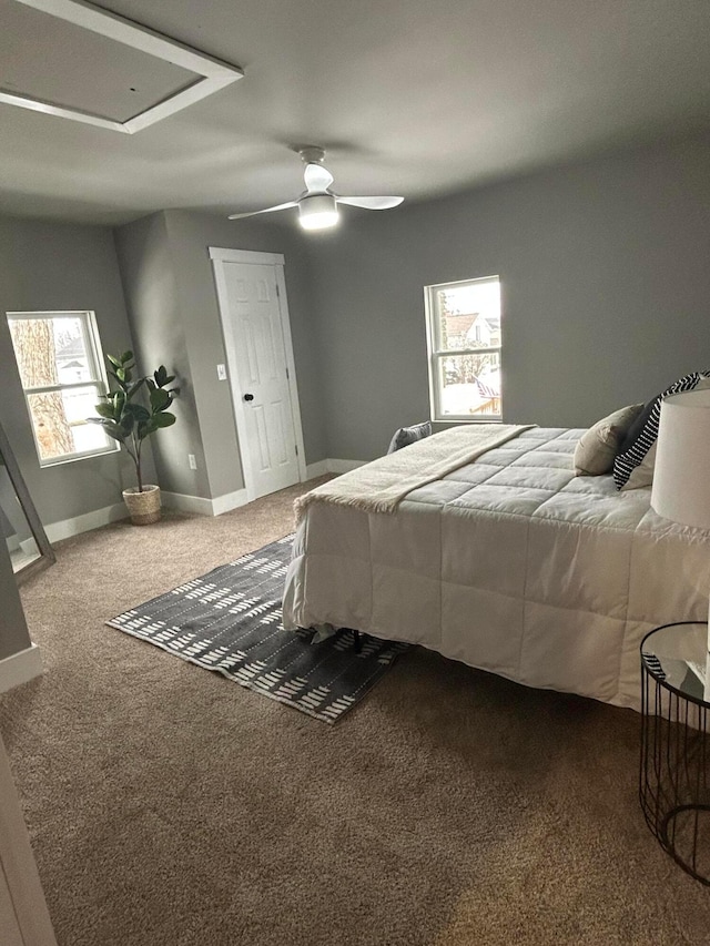 carpeted bedroom featuring ceiling fan