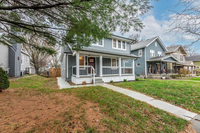 view of front of home with a front lawn and covered porch