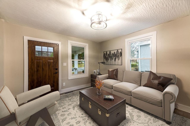 living room with a textured ceiling