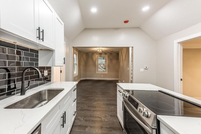 kitchen with vaulted ceiling, sink, dark wood-type flooring, and stainless steel electric range