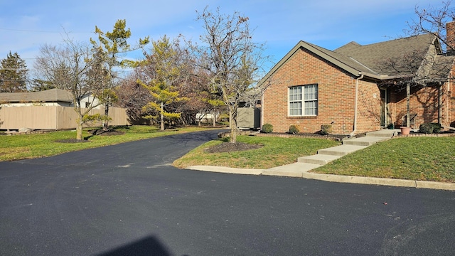 exterior space with a front yard