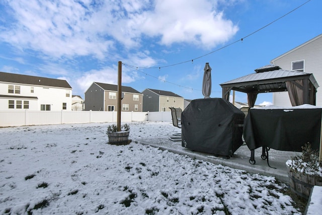 yard layered in snow featuring a gazebo