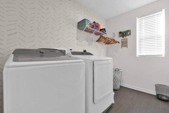 laundry area with washing machine and dryer and plenty of natural light