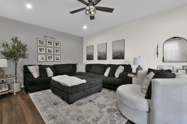 living room featuring hardwood / wood-style flooring and ceiling fan