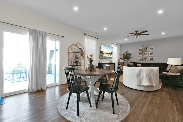 dining room with hardwood / wood-style flooring and ceiling fan