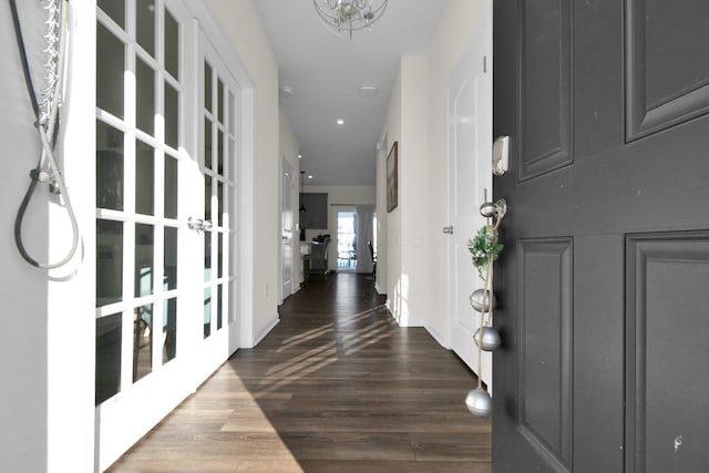 entrance foyer with french doors and dark wood-type flooring