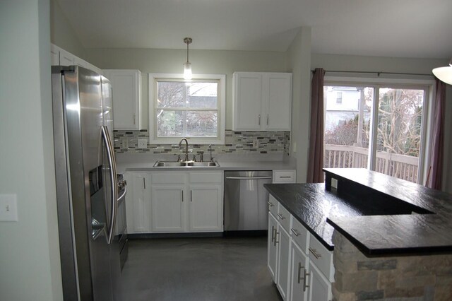 kitchen featuring white cabinetry, sink, and stainless steel appliances