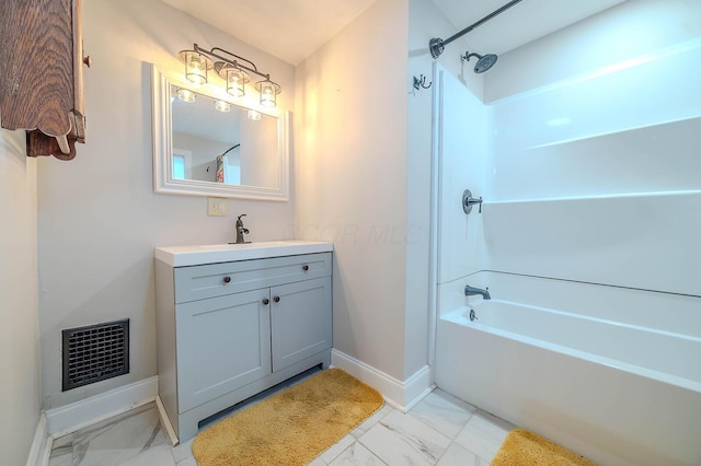 bathroom featuring vanity and shower / bath combination