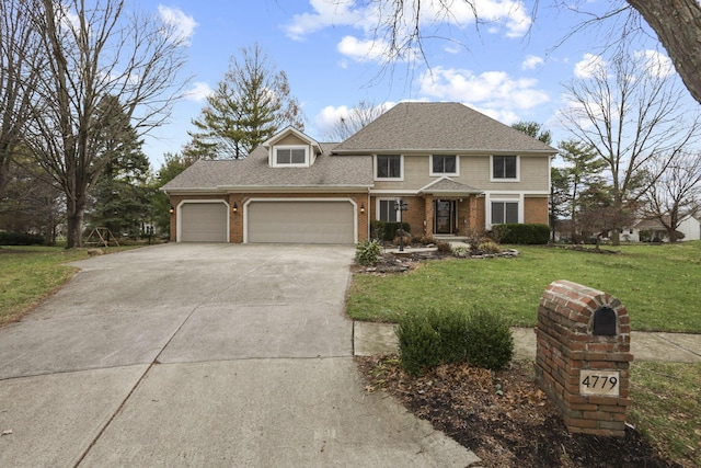 view of front of home with a front yard and a garage