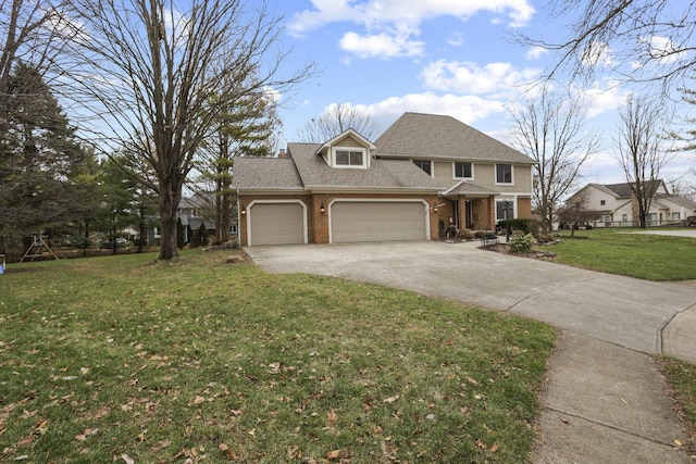 view of front of home with a front lawn and a garage