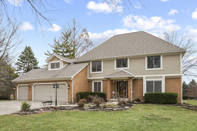 view of property with a front yard and a garage