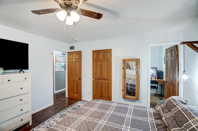 bedroom with ceiling fan and dark wood-type flooring