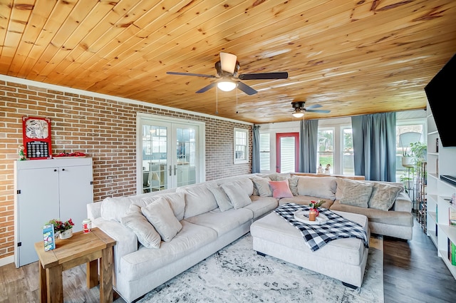 living room with ceiling fan, french doors, brick wall, wood ceiling, and hardwood / wood-style flooring