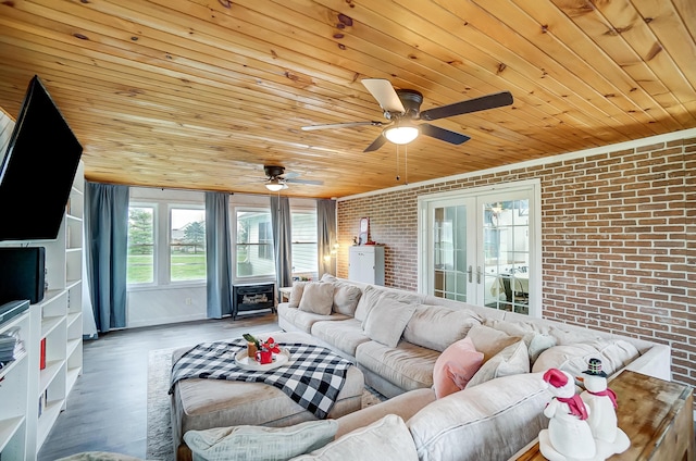 living room featuring french doors, wooden ceiling, dark wood-type flooring, and brick wall