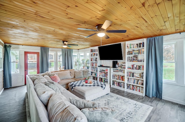 living room with hardwood / wood-style flooring, plenty of natural light, and wooden ceiling