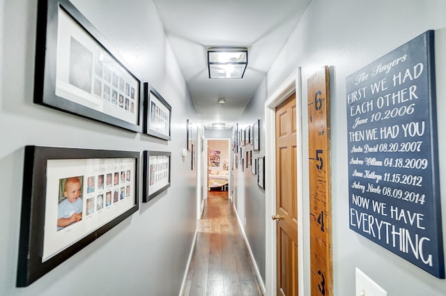 corridor featuring hardwood / wood-style floors