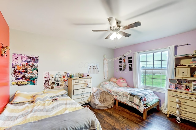 bedroom with ceiling fan and dark wood-type flooring