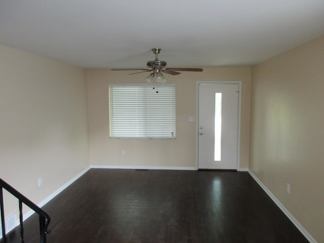 foyer entrance featuring dark hardwood / wood-style floors and ceiling fan