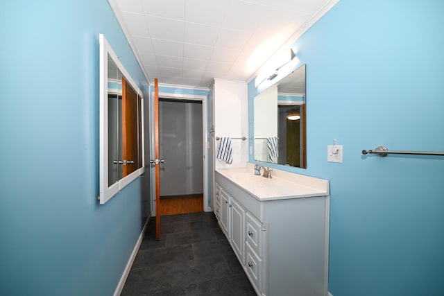 bathroom with vanity and crown molding