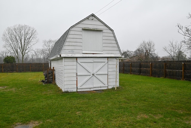 view of outdoor structure with a lawn