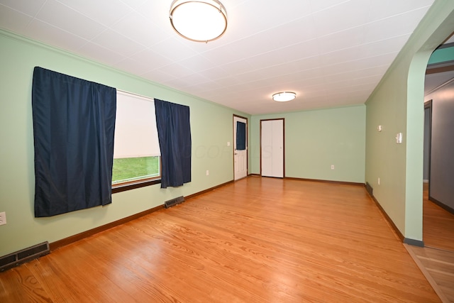 empty room with wood-type flooring