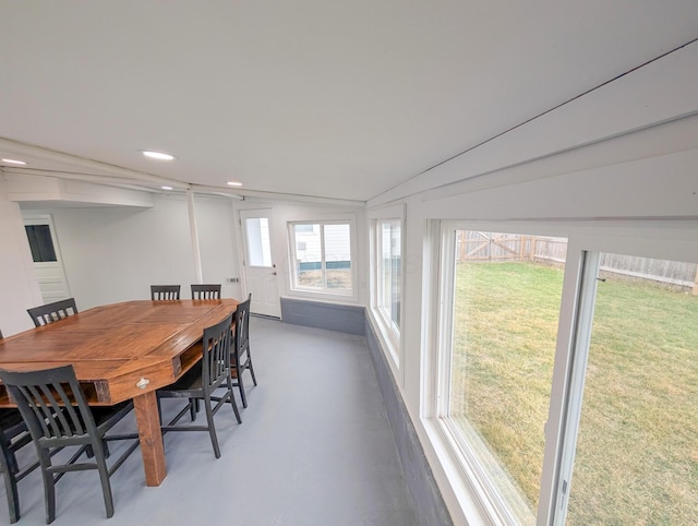 dining space featuring concrete flooring