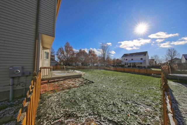 view of yard with a patio area and a trampoline