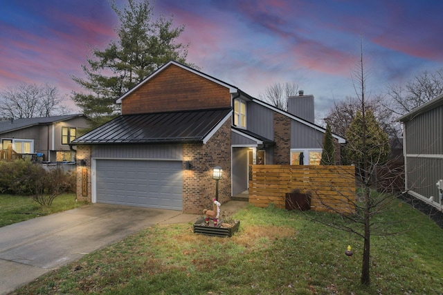 view of front facade featuring a yard and a garage