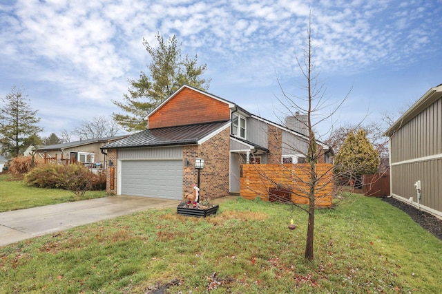 view of front of property featuring a front lawn and a garage