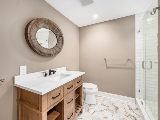 bathroom featuring toilet, a shower with door, and vanity