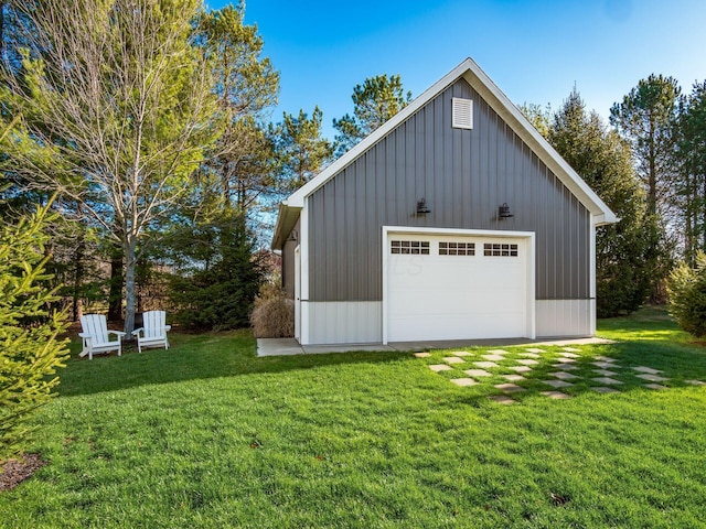 garage featuring a lawn