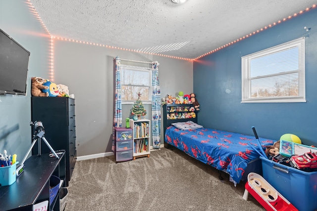 carpeted bedroom featuring a textured ceiling