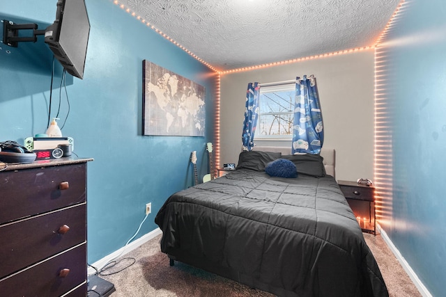 bedroom with carpet flooring and a textured ceiling