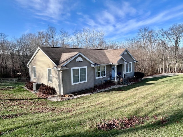 single story home featuring central air condition unit and a front lawn