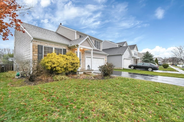 view of front of home with a garage and a front lawn