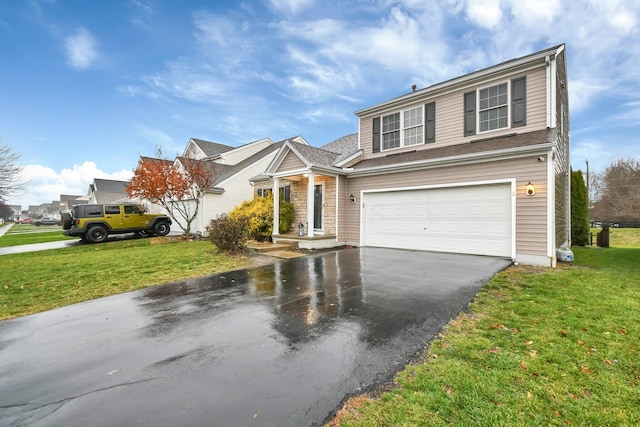 view of front property with a garage and a front yard