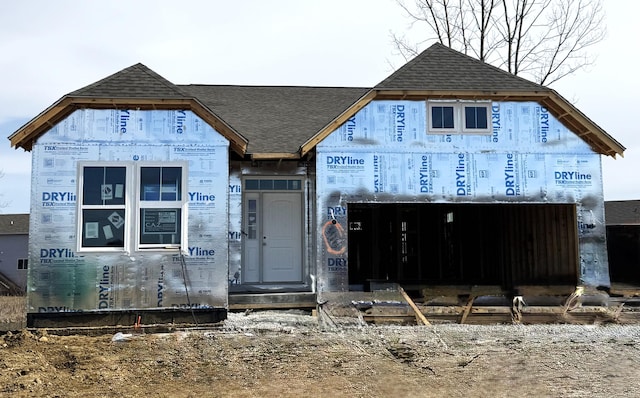 property in mid-construction with roof with shingles