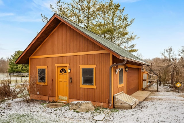 view of front of home featuring a shingled roof