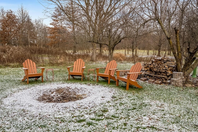 view of yard with a fire pit