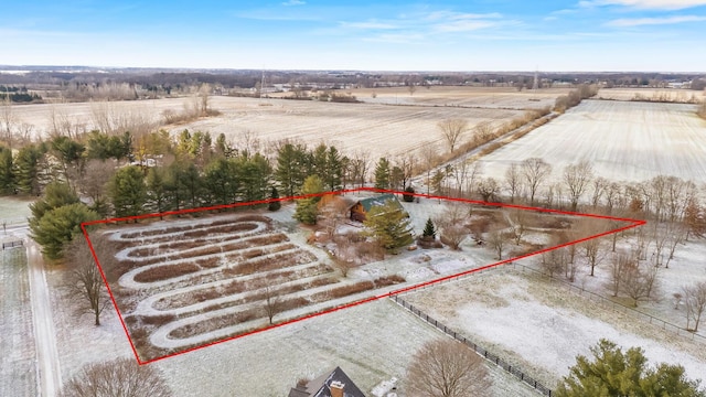 birds eye view of property featuring a rural view