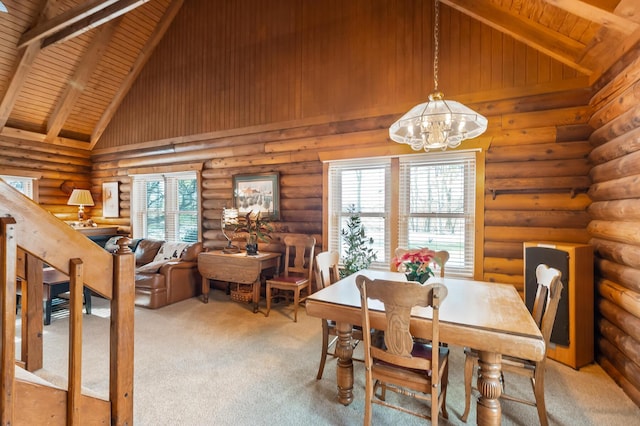 carpeted dining space with rustic walls, a chandelier, wooden ceiling, beamed ceiling, and high vaulted ceiling