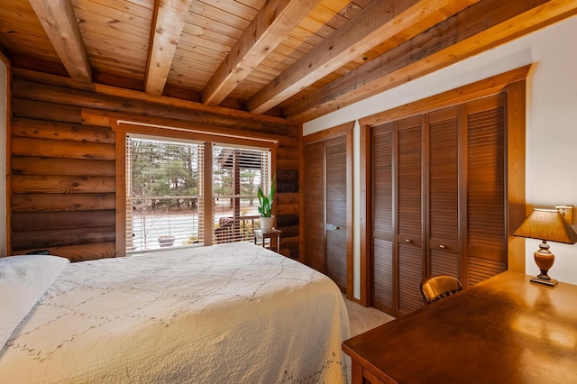 bedroom featuring wood ceiling, beam ceiling, log walls, and two closets