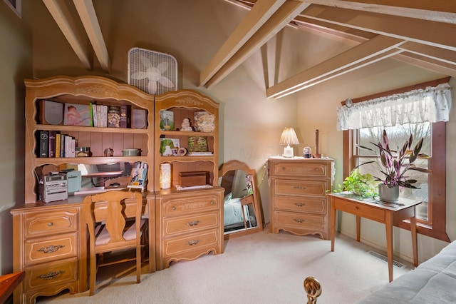 office area with vaulted ceiling, visible vents, and light colored carpet