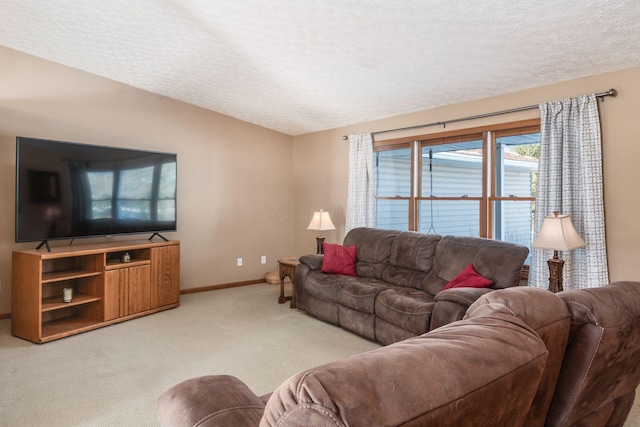 living room with a textured ceiling and light carpet